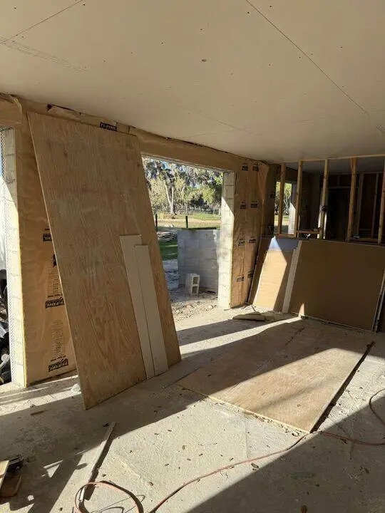 Drywall sheets installed on new framing