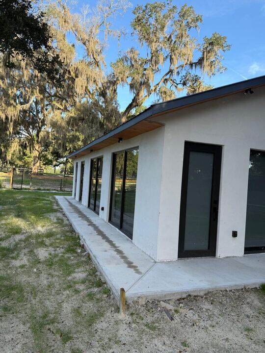 New home exterior with sliding glass doors