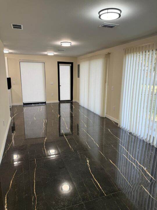 Living room with polished marble flooring