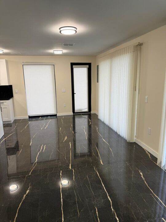 Open living area with tile flooring