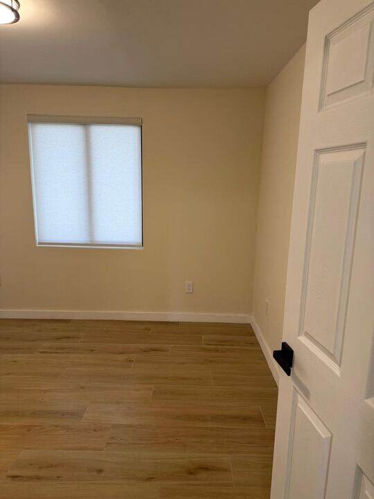 Finished bedroom with wood floor